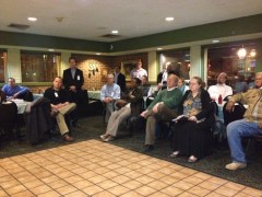 Attendees listen to a presentation about plans for a residential building at 1550 Penn Ave SE.